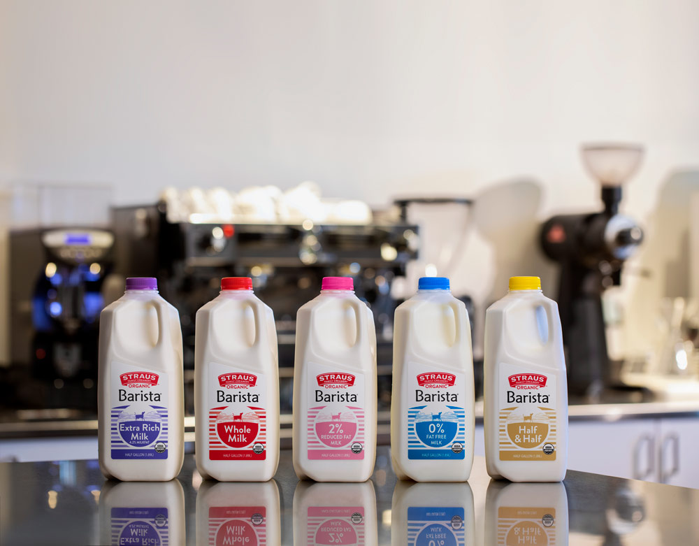 row of straus barista milk options in a cafe