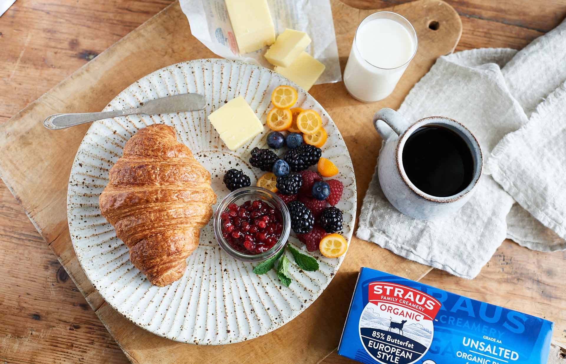 plate of breakfast next to straus unsalted European style butter