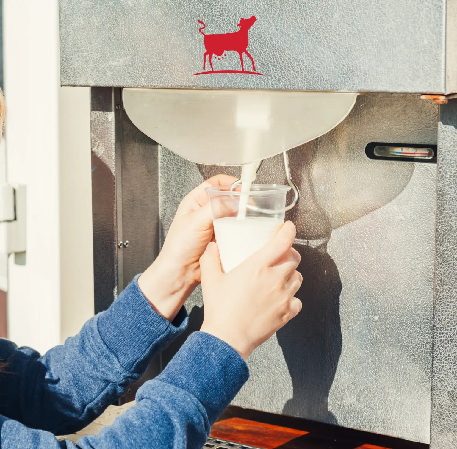 kid getting milk from machine adobestock 79410400 1