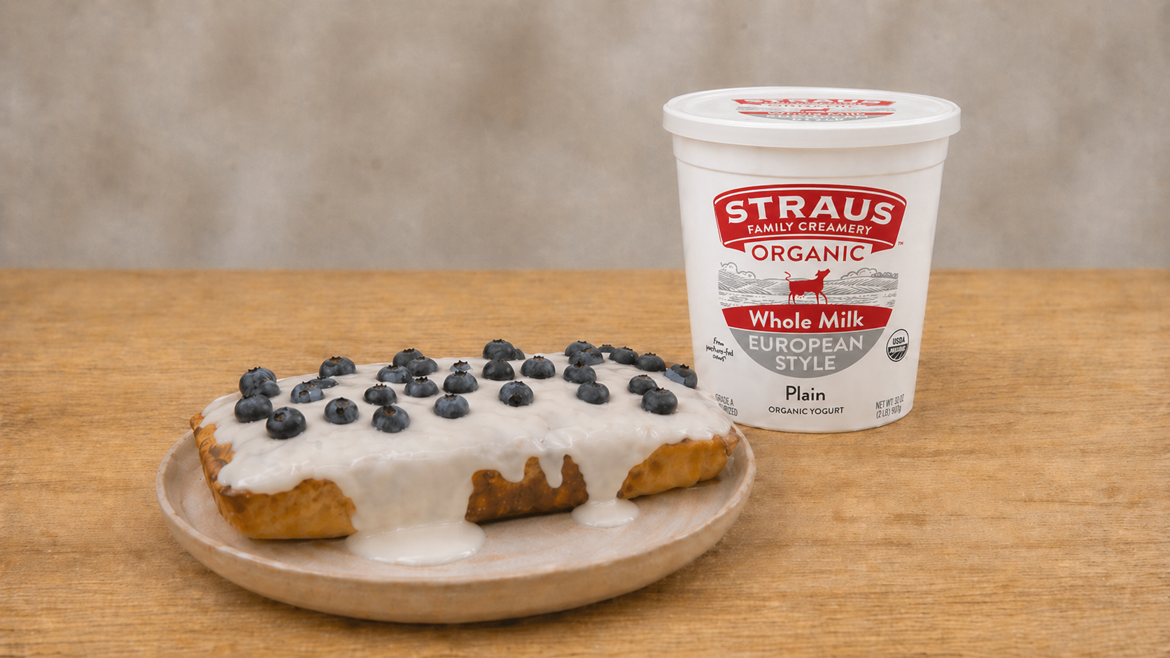 Glazed oat cake topped with fresh blueberries made with Straus Organic Whole Milk European Style Plain Yogurt